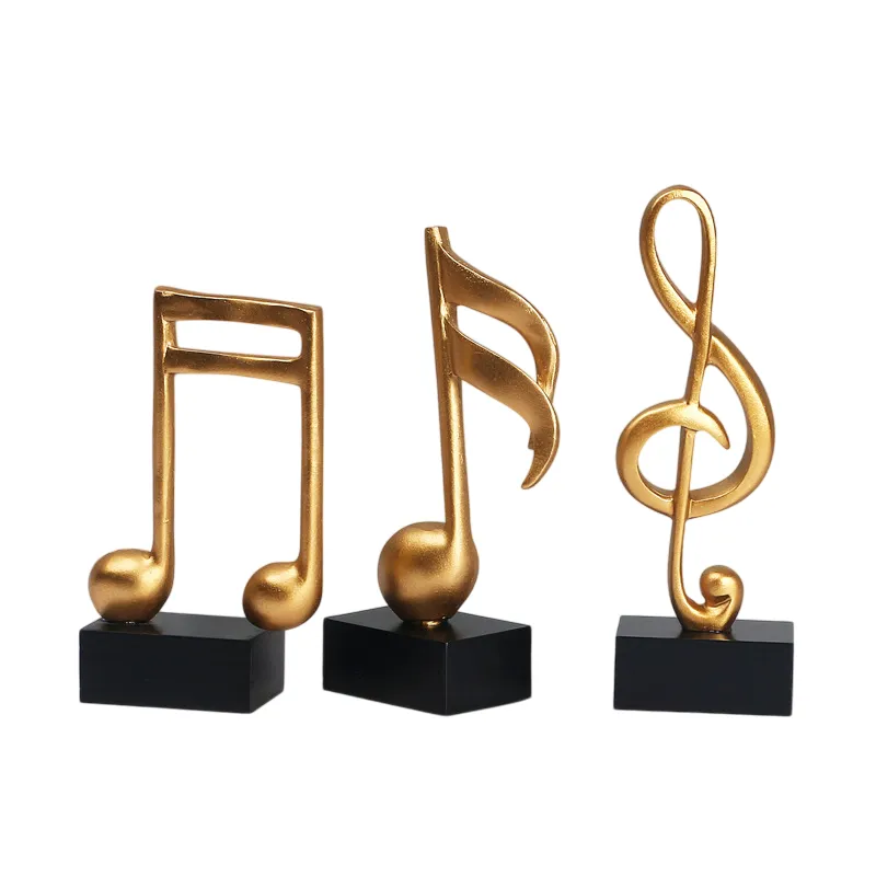 Goldene Musiknoten im 3er-Set auf schwarzem Sockel